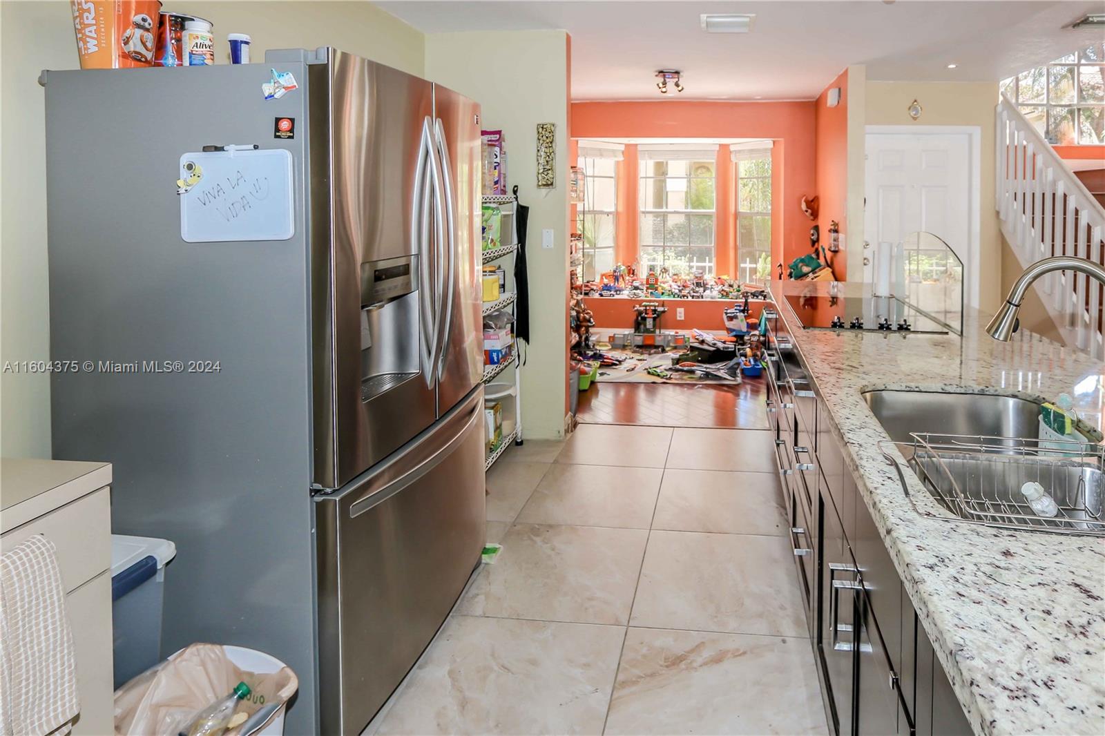 15253 Southwest 111th Street Miami, FL 33196 - Photo 10 of 32 a kitchen with stainless steel appliances granite countertop a refrigerator and a sink