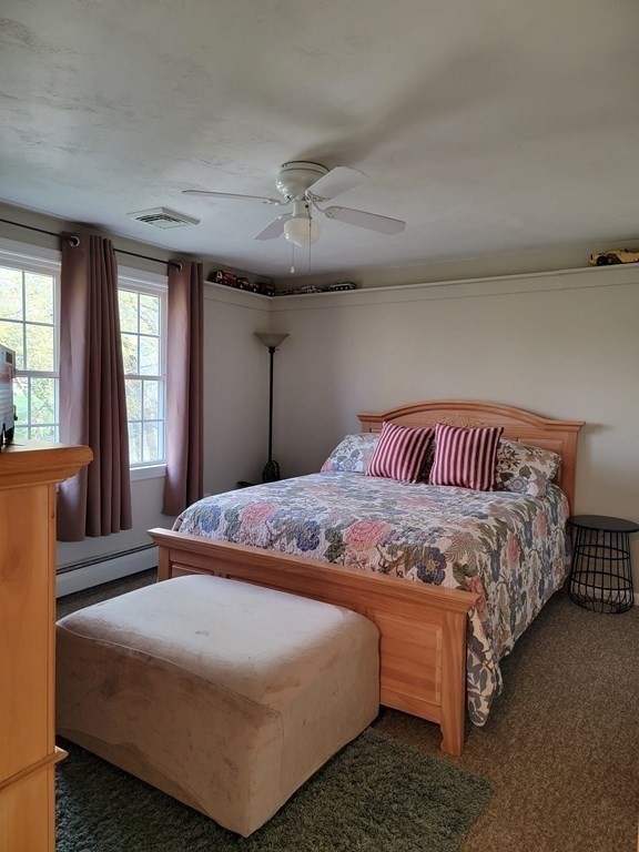 2 Ivy Lane Rutland, MA 01543 - Photo 13 of 34 a bedroom with a bed and wooden floor