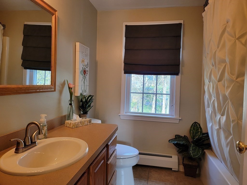 2 Ivy Lane Rutland, MA 01543 - Photo 14 of 34 a bathroom with a sink a toilet and a window