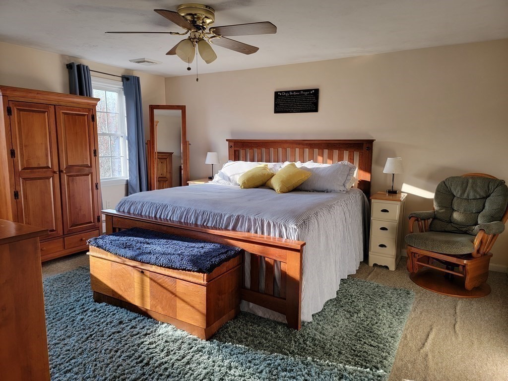 2 Ivy Lane Rutland, MA 01543 - Photo 15 of 34 a bedroom with a bed and a couch