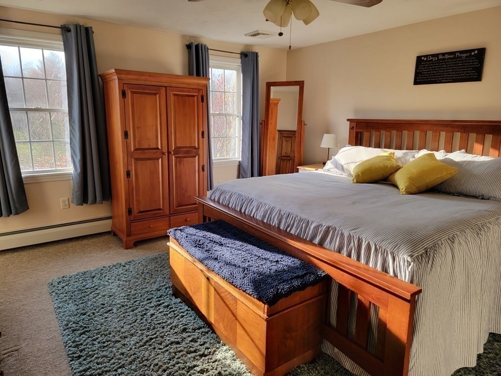 2 Ivy Lane Rutland, MA 01543 - Photo 16 of 34 a bed sitting in a bedroom next to a window