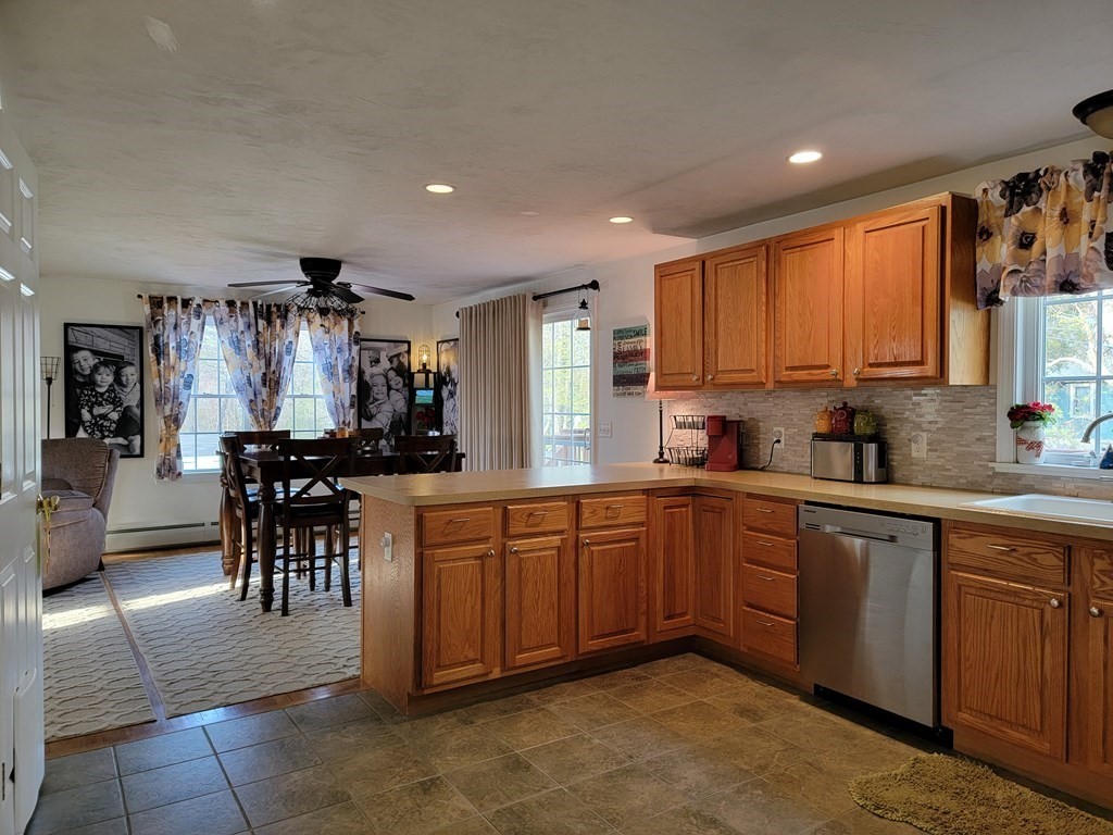 2 Ivy Lane Rutland, MA 01543 - Photo 2 of 34 a large kitchen with cabinets chairs and refrigerator