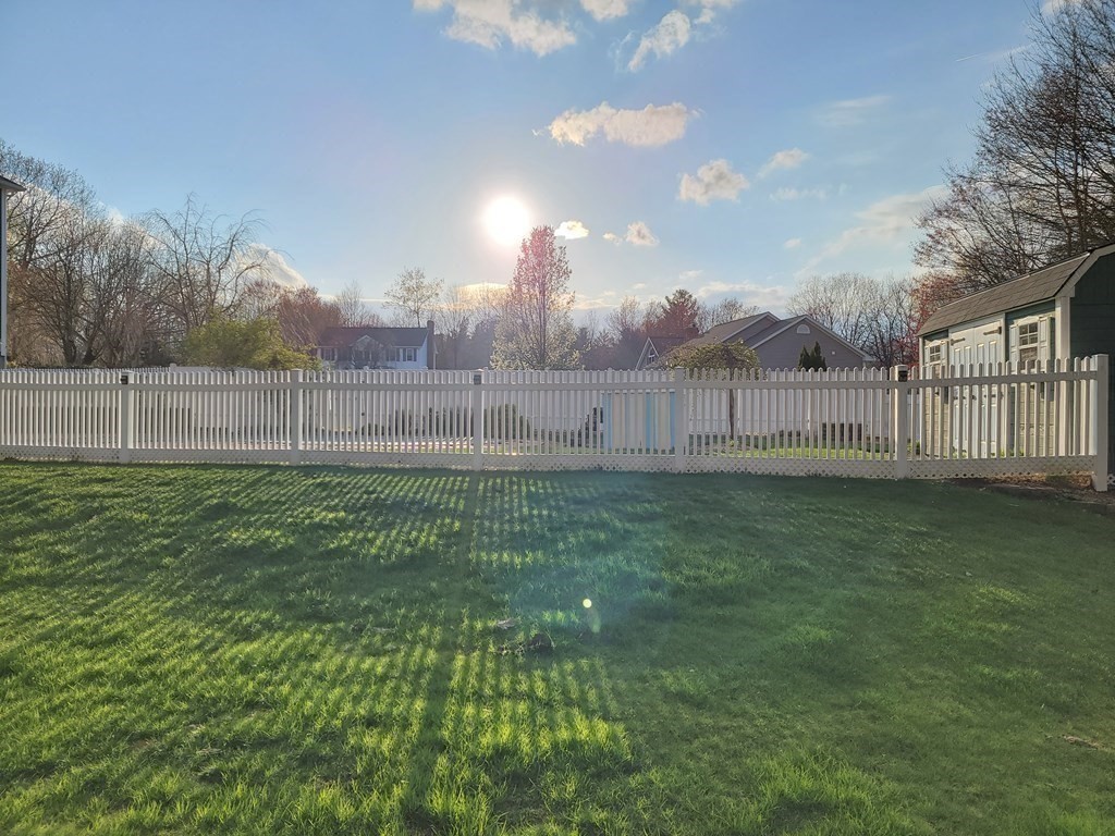 2 Ivy Lane Rutland, MA 01543 - Photo 26 of 34 a view of a yard with a big yard and wooden fence