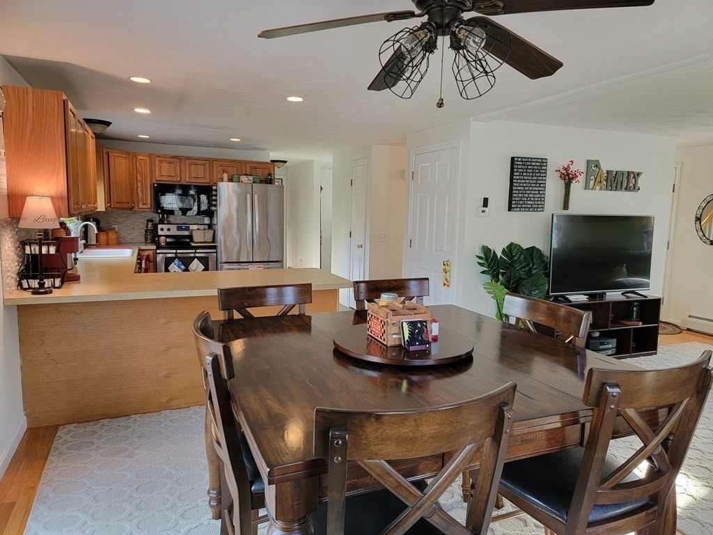 2 Ivy Lane Rutland, MA 01543 - Photo 5 of 34 a kitchen with a table and chairs in it