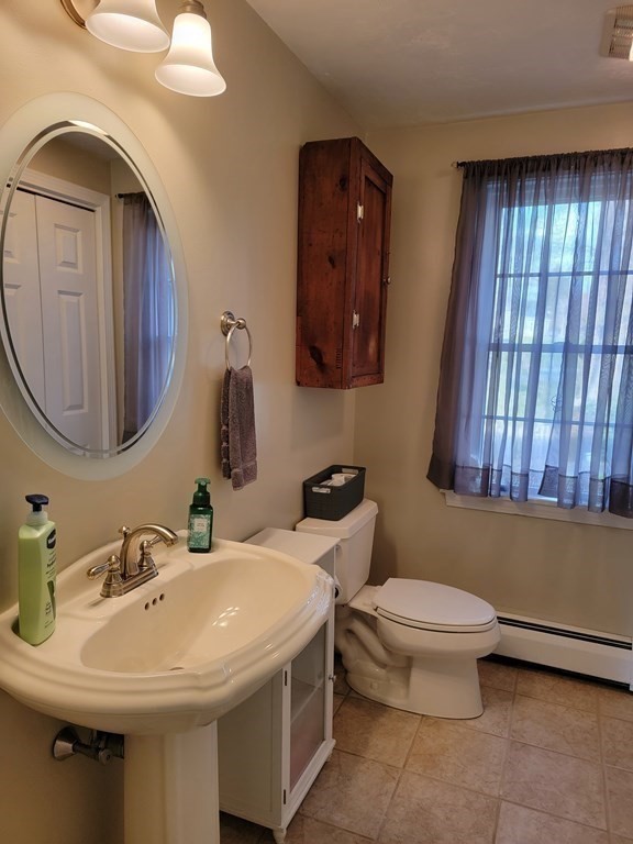 2 Ivy Lane Rutland, MA 01543 - Photo 10 of 34 a bathroom with a toilet sink and mirror