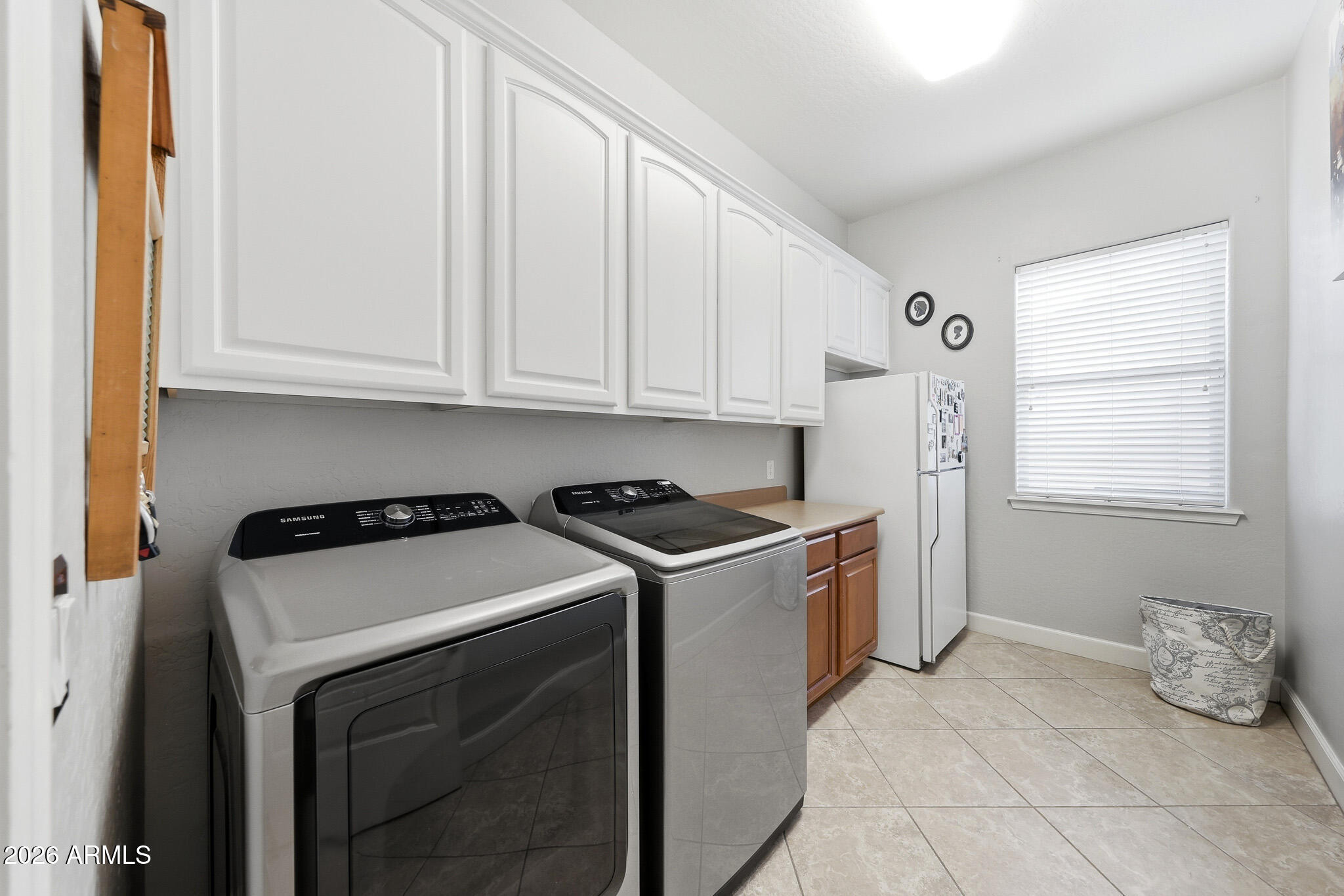 18174 West Narramore Road Goodyear, AZ 85338 - Photo 24 of 35 Laundry Room with Storage