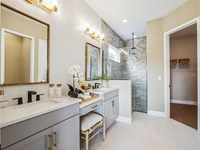 a bathroom with a double vanity sink mirror and double