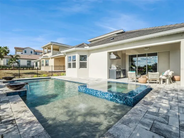a view of a patio with swimming pool table and chairs