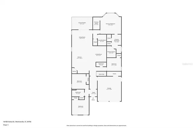 an aerial view of a city with lots of residential buildings ocean and mountain view in back