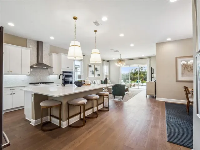 a large kitchen with lots of counter space and windows