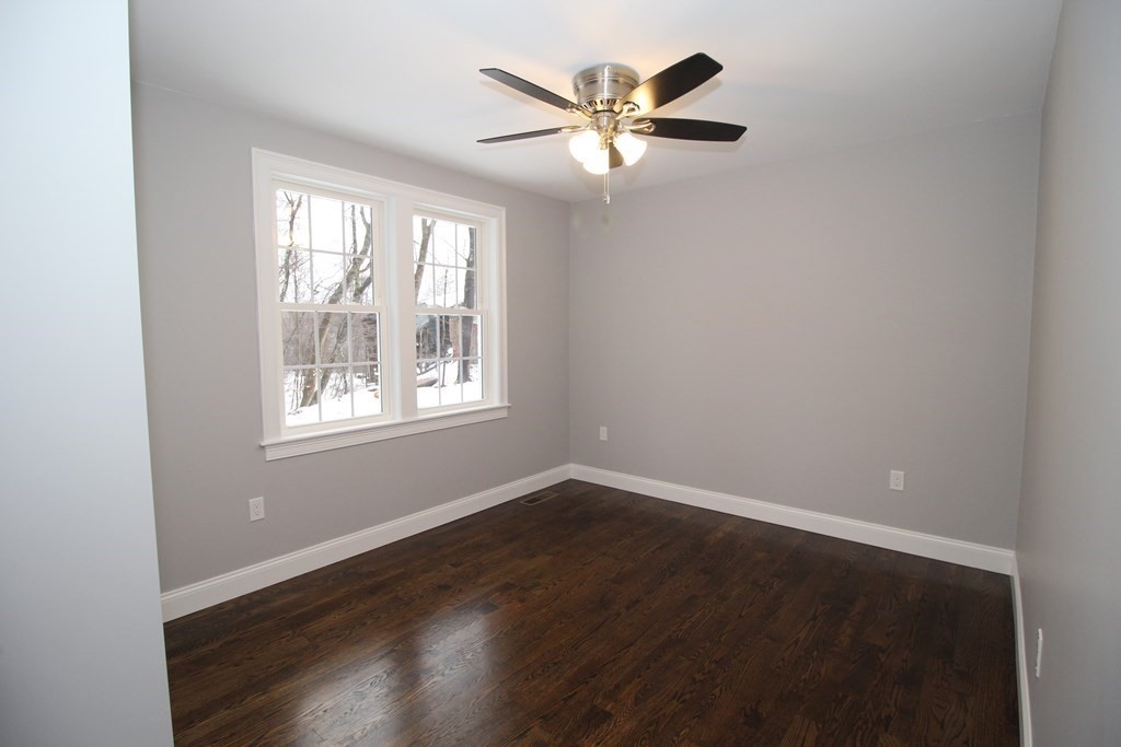 79 Dudley Road Templeton, MA 01468 - Photo 12 of 40 an empty room with wooden floor and windows