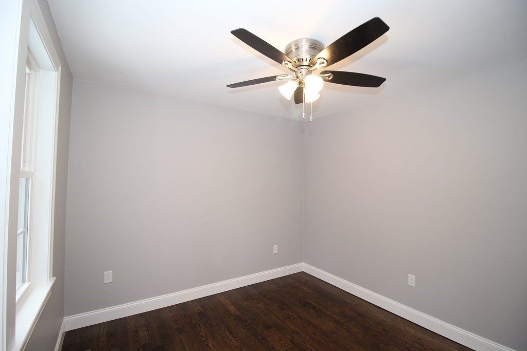 79 Dudley Road Templeton, MA 01468 - Photo 13 of 40 an empty room with a chandelier fan and closet