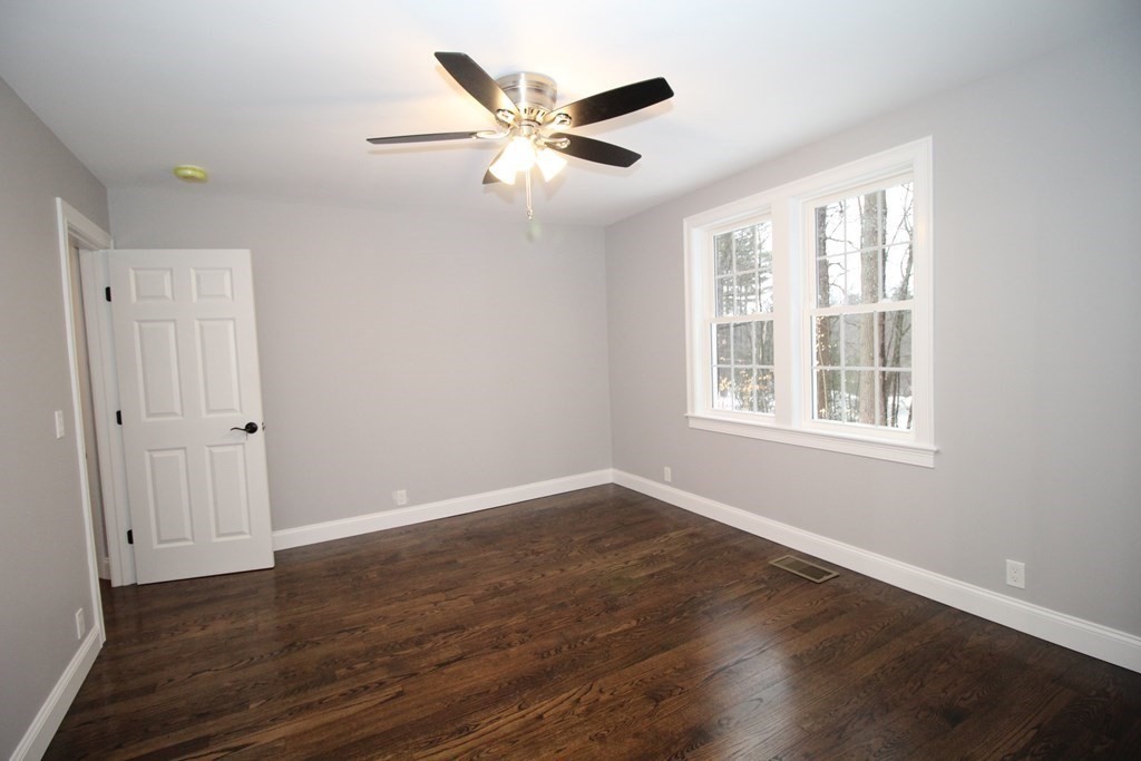 79 Dudley Road Templeton, MA 01468 - Photo 18 of 40 a view of an empty room with wooden floor and a window
