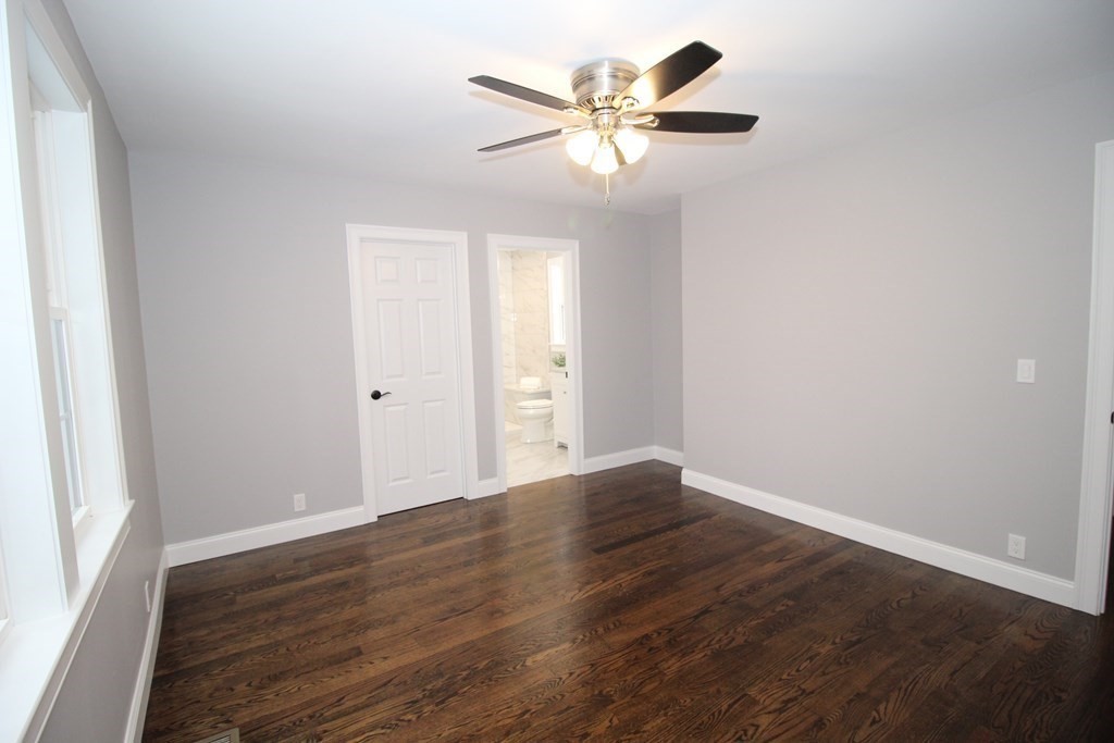 79 Dudley Road Templeton, MA 01468 - Photo 19 of 40 an empty room with wooden floor and windows