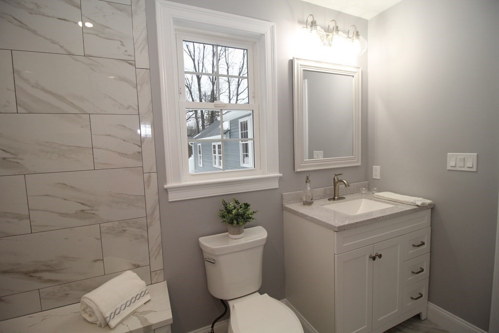 79 Dudley Road Templeton, MA 01468 - Photo 20 of 40 a bathroom with a toilet sink and mirror