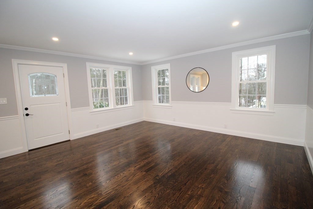 79 Dudley Road Templeton, MA 01468 - Photo 23 of 40 an empty room with wooden floor and windows