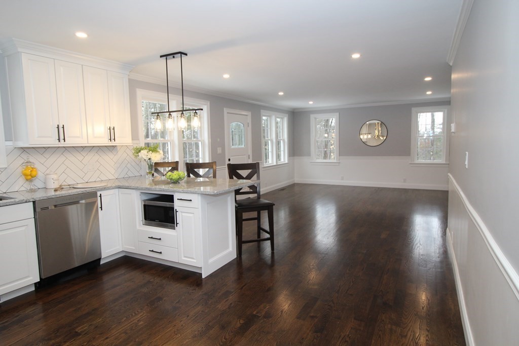 79 Dudley Road Templeton, MA 01468 - Photo 24 of 40 a kitchen that has a lot of white cabinets and wooden floor