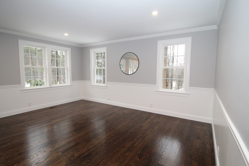 79 Dudley Road Templeton, MA 01468 - Photo 25 of 40 a view of an empty room with wooden floor and a window