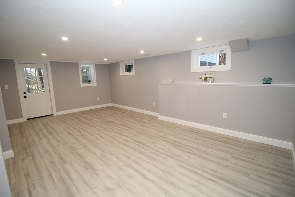 79 Dudley Road Templeton, MA 01468 - Photo 27 of 40 an empty room with wooden floor and windows