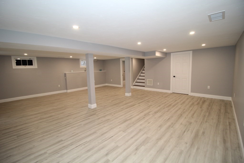 79 Dudley Road Templeton, MA 01468 - Photo 28 of 40 an empty room with wooden floor and windows