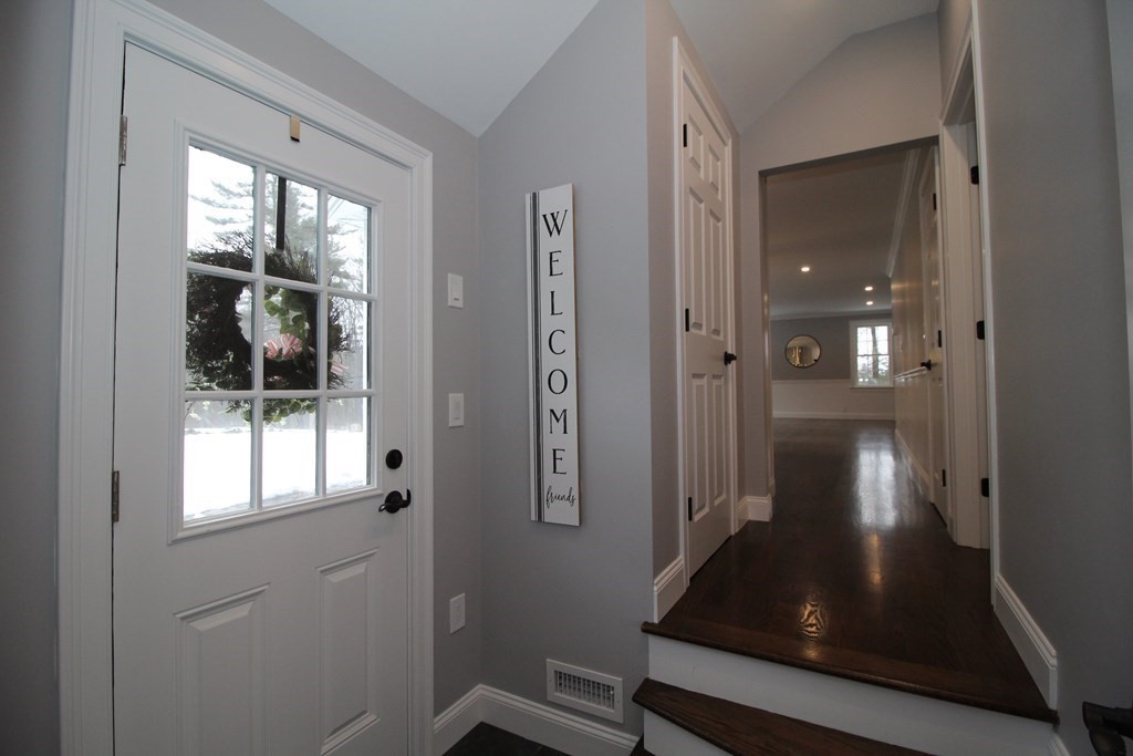 79 Dudley Road Templeton, MA 01468 - Photo 3 of 40 a view of a hallway with wooden floor and glass door