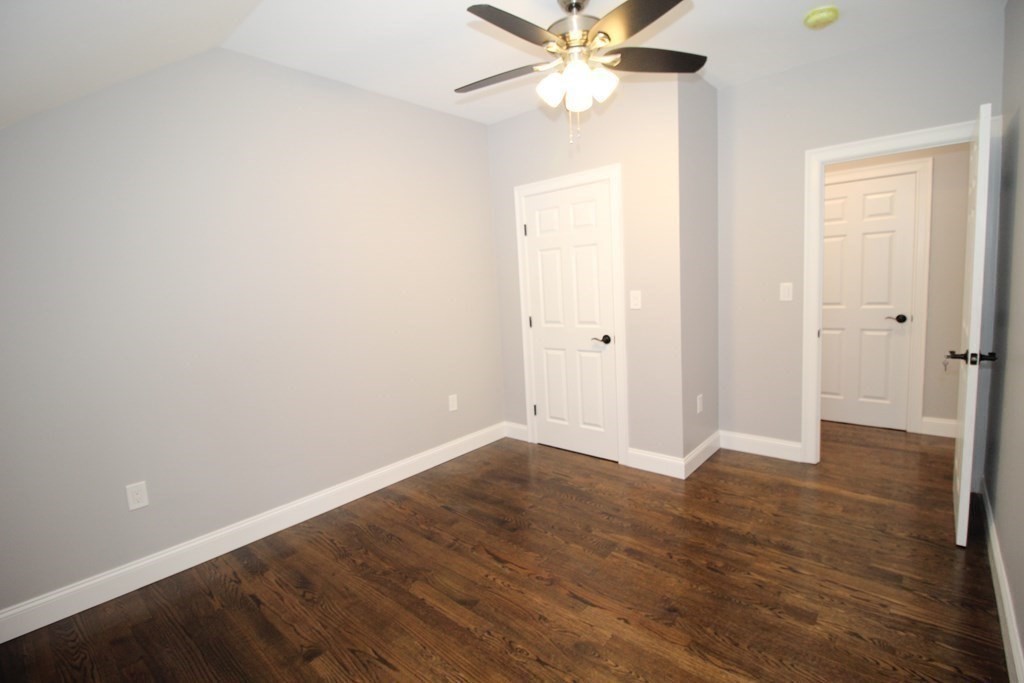 79 Dudley Road Templeton, MA 01468 - Photo 33 of 40 an empty room with wooden floor and fan