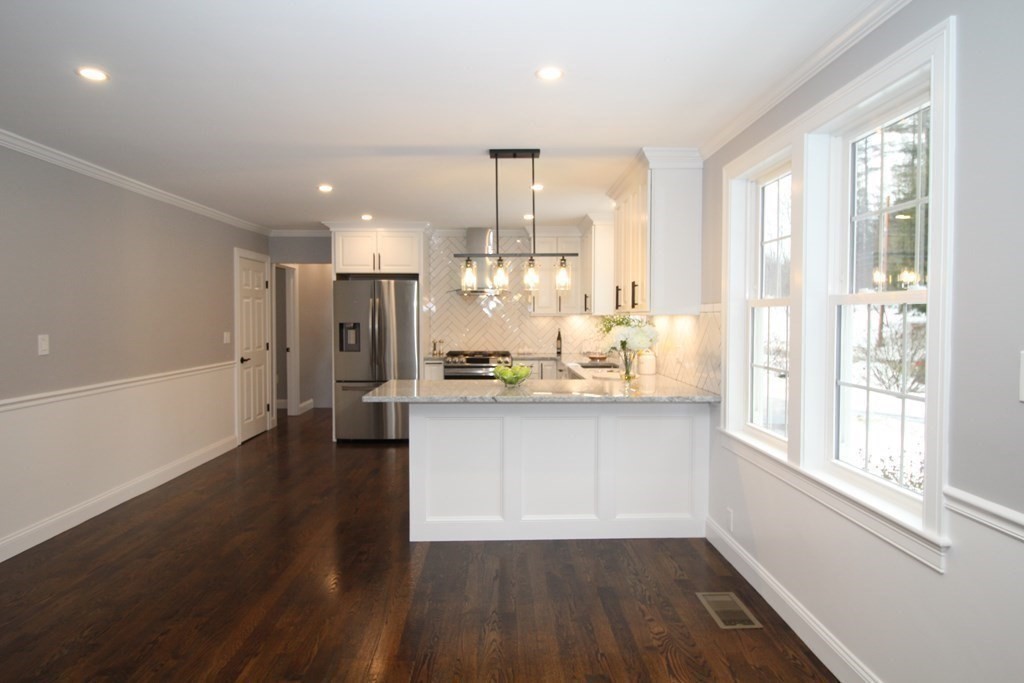 79 Dudley Road Templeton, MA 01468 - Photo 34 of 40 a kitchen with stainless steel appliances wooden floor and a large window