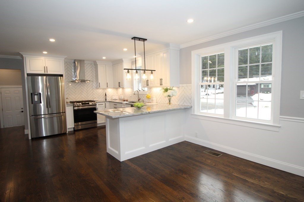 79 Dudley Road Templeton, MA 01468 - Photo 35 of 40 a kitchen with stainless steel appliances wooden floor a refrigerator and a window