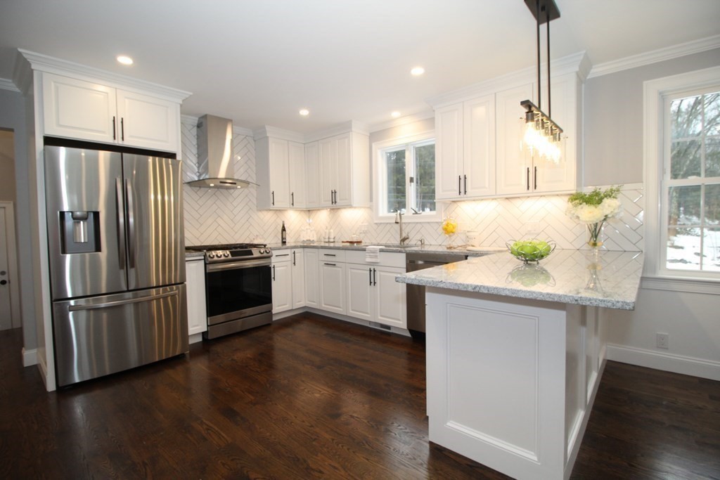 79 Dudley Road Templeton, MA 01468 - Photo 37 of 40 a kitchen with stainless steel appliances a sink a stove a refrigerator and island