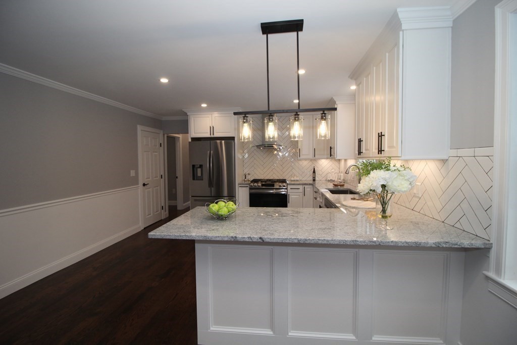 79 Dudley Road Templeton, MA 01468 - Photo 38 of 40 a kitchen with kitchen island a sink appliances and a counter top space