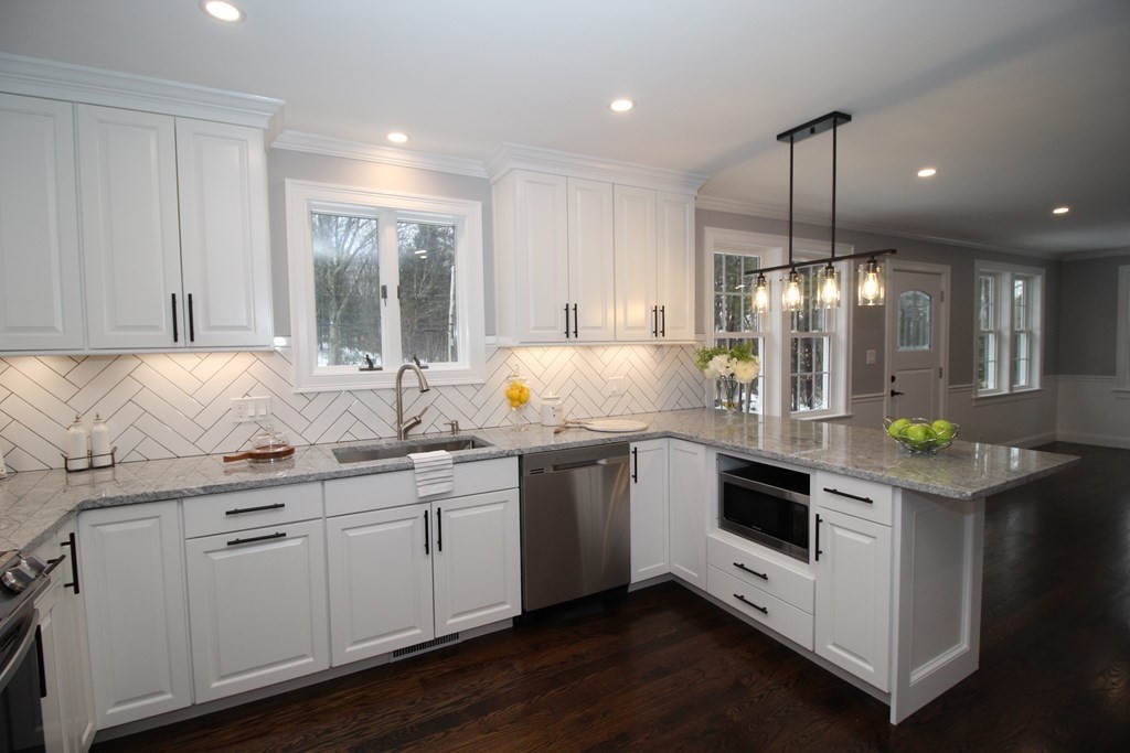 79 Dudley Road Templeton, MA 01468 - Photo 8 of 40 a kitchen with granite countertop white cabinets and white appliances