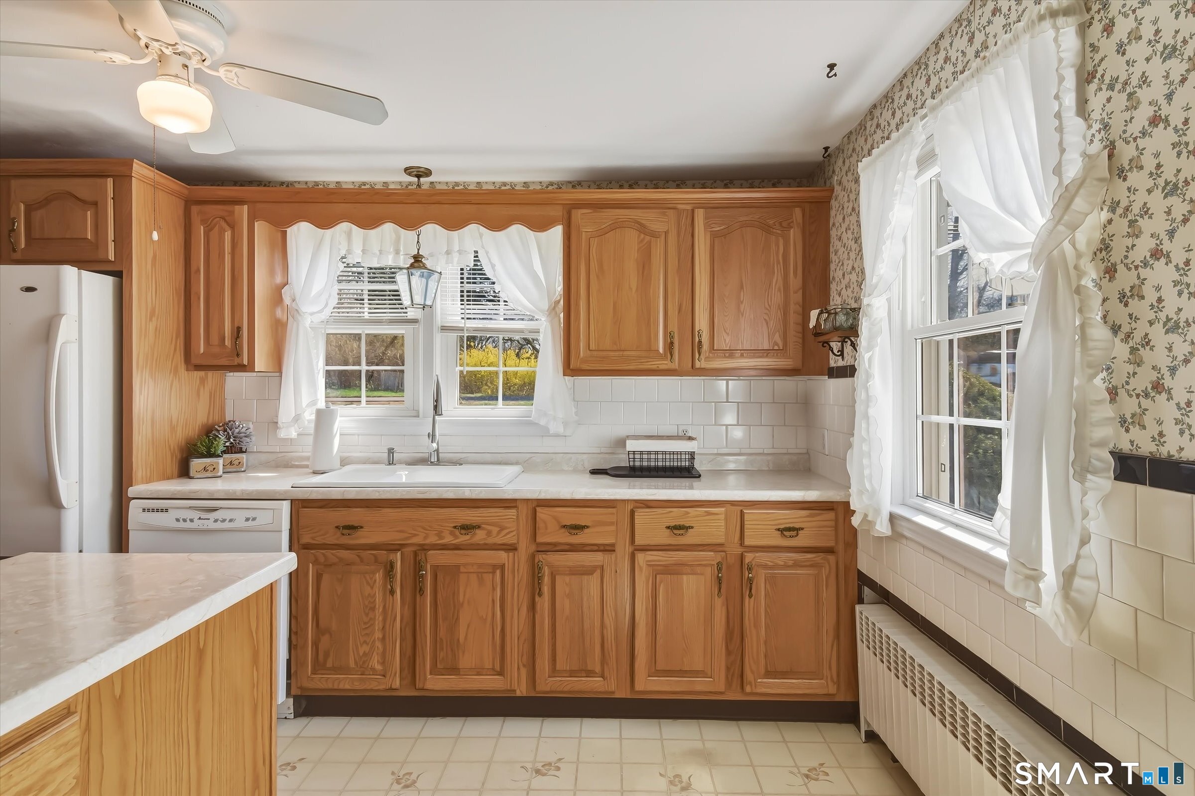 204 Branford Road North Branford, CT 06471 - Photo 13 of 39 a kitchen with a sink window and cabinets