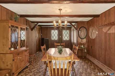 a kitchen with a sink window and cabinets