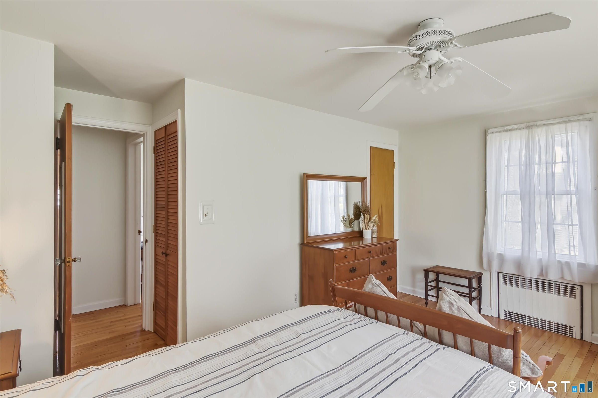 204 Branford Road North Branford, CT 06471 - Photo 19 of 39 a bedroom with a bed and a chandelier