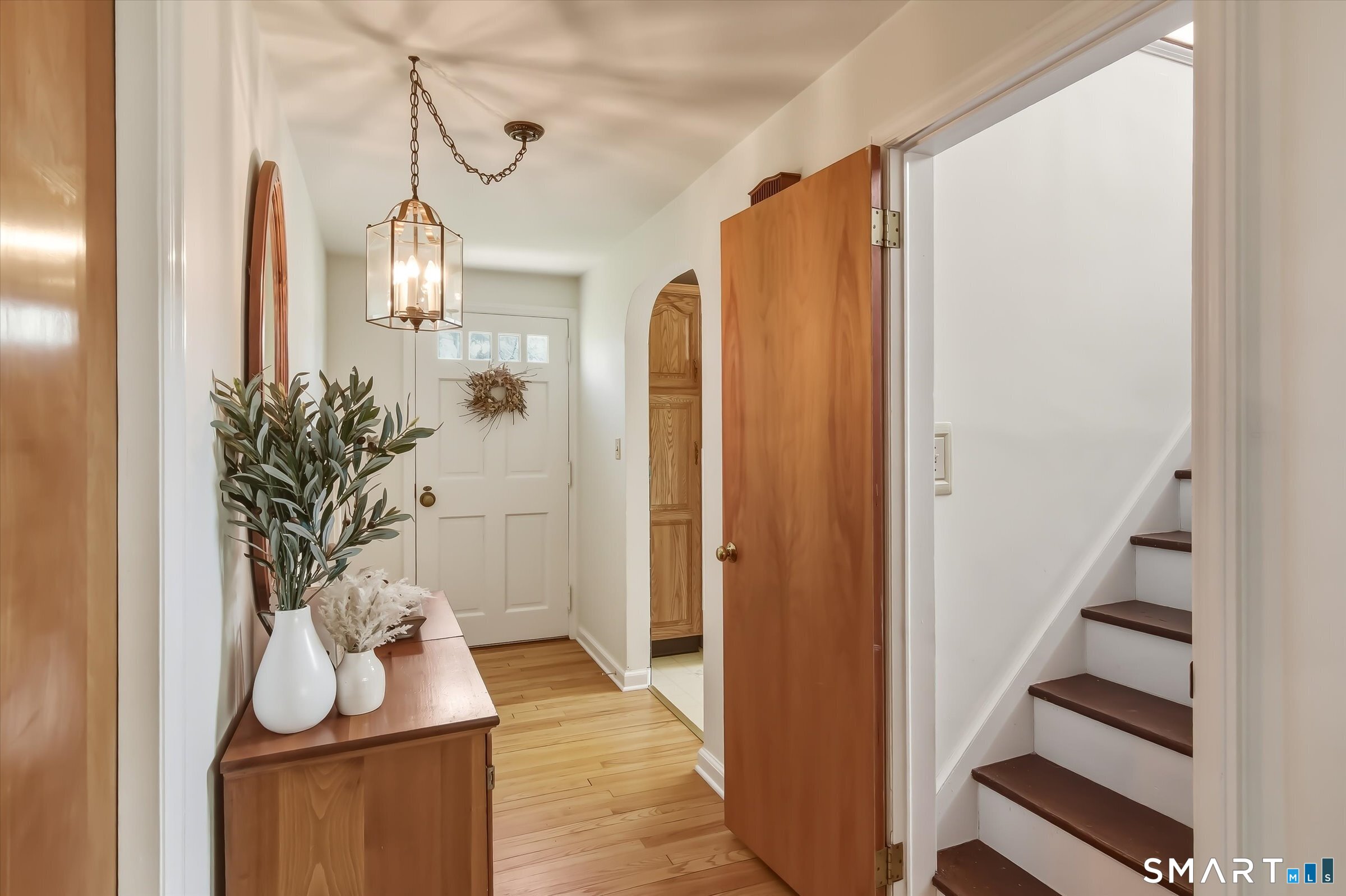 204 Branford Road North Branford, CT 06471 - Photo 21 of 39 a view of a hallway with wooden floor and entryway