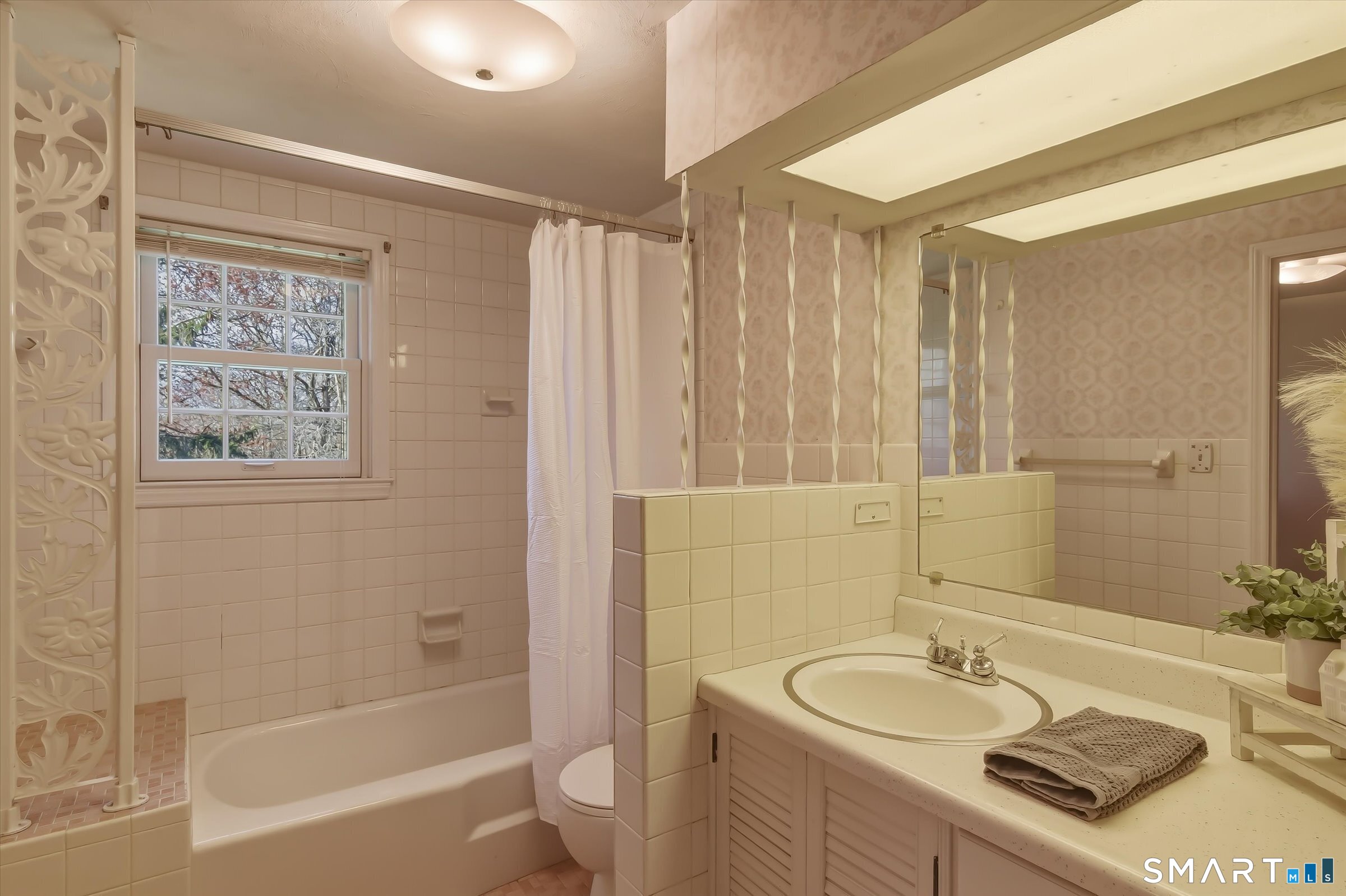 204 Branford Road North Branford, CT 06471 - Photo 26 of 39 a bathroom with a granite countertop sink toilet a mirror a bathtub and shower