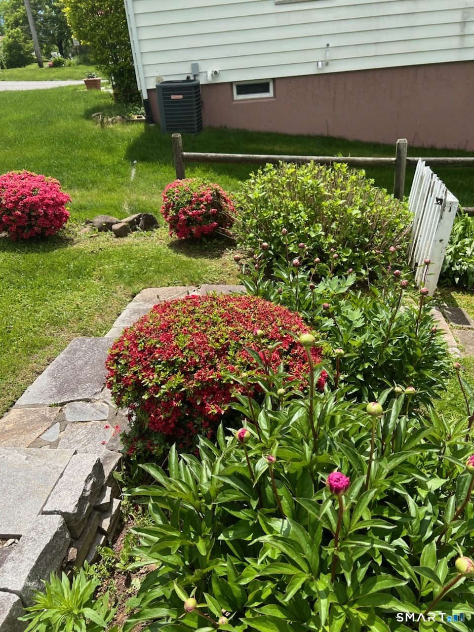 204 Branford Road North Branford, CT 06471 - Photo 35 of 39 a view of a backyard with plants and a fountain