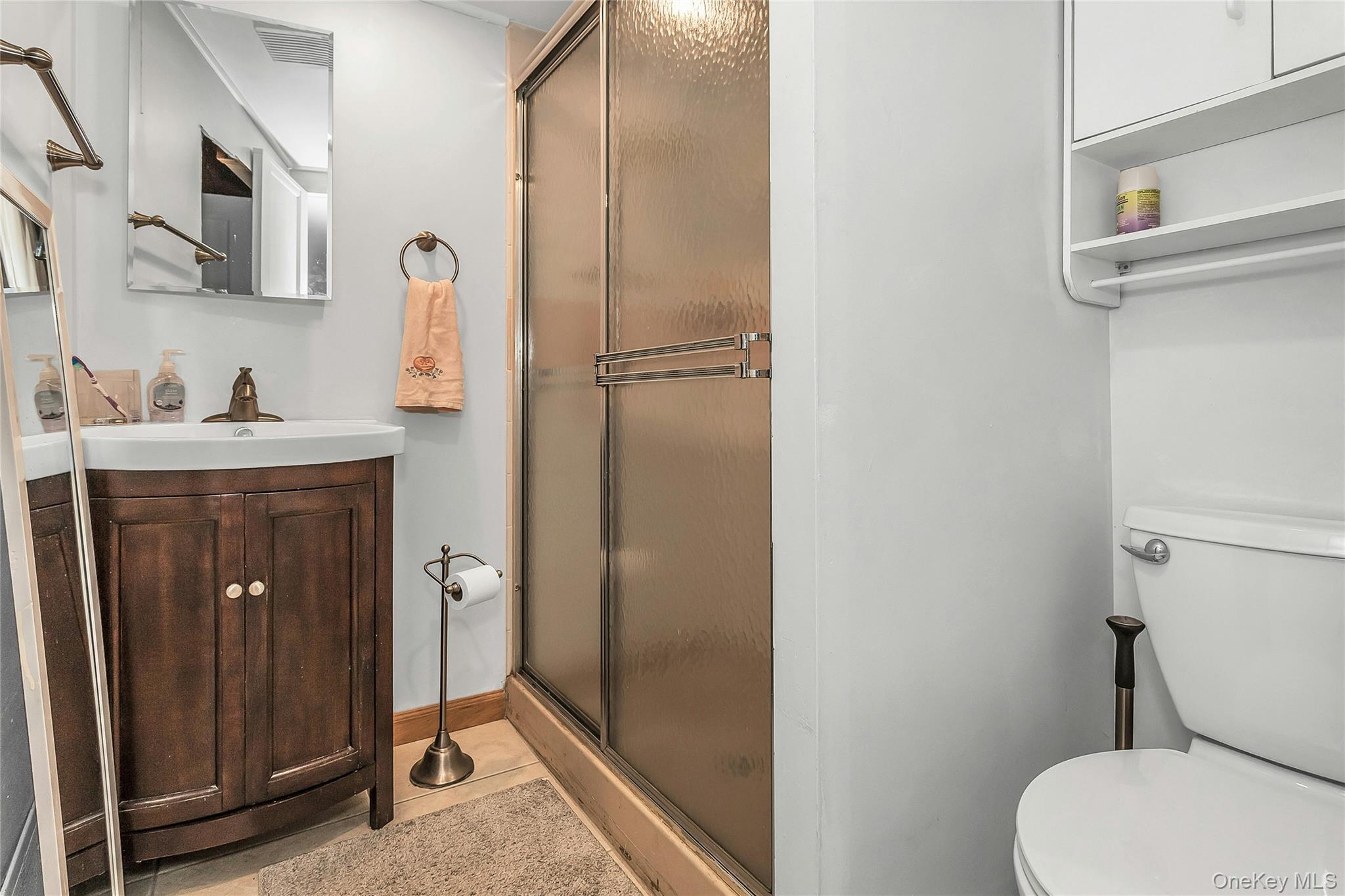 622 Wellelein Road Uniondale, NY 11553 - Photo 15 of 18 Full bath featuring a shower stall and vanity