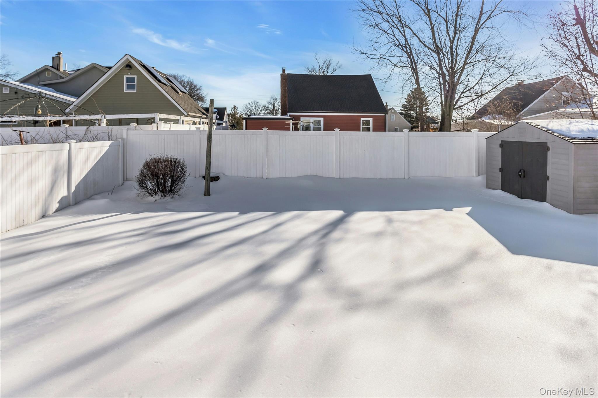 622 Wellelein Road Uniondale, NY 11553 - Photo 18 of 18 Fenced backyard featuring a shed