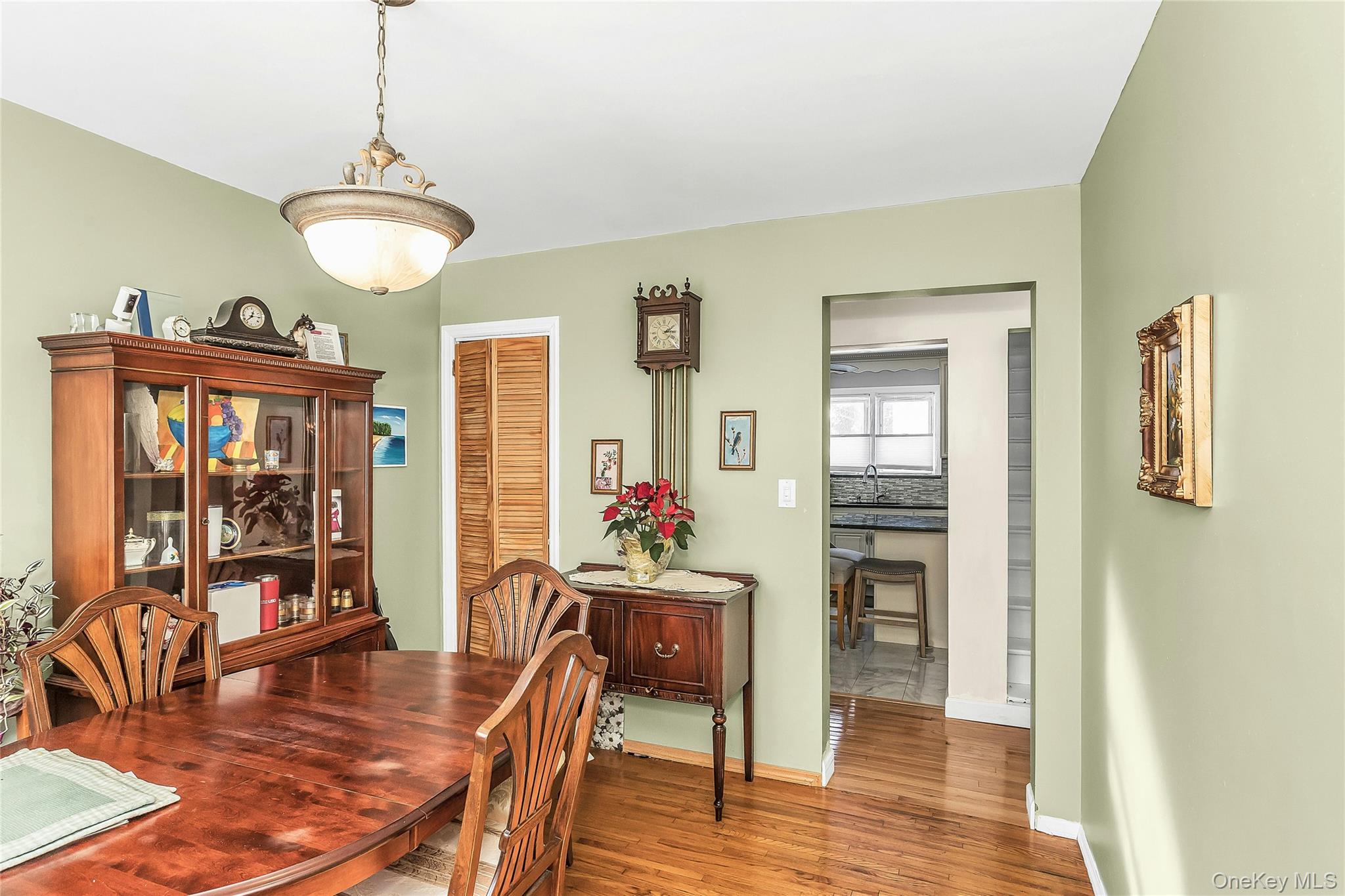 622 Wellelein Road Uniondale, NY 11553 - Photo 4 of 18 Dining space with light wood finished floors and baseboards