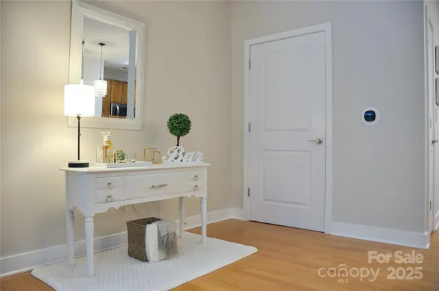 a bathroom with a granite countertop sink a toilet and mirror