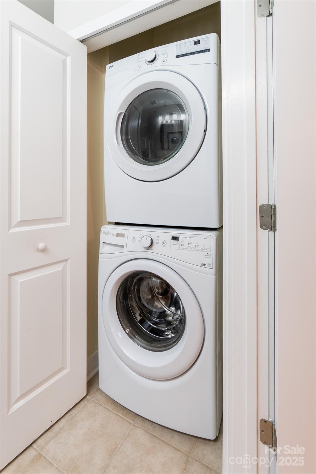 630 Calvert Street, Unit 1110 Charlotte, NC 28208 - Photo 25 of 28 a utility room with dryer and washer