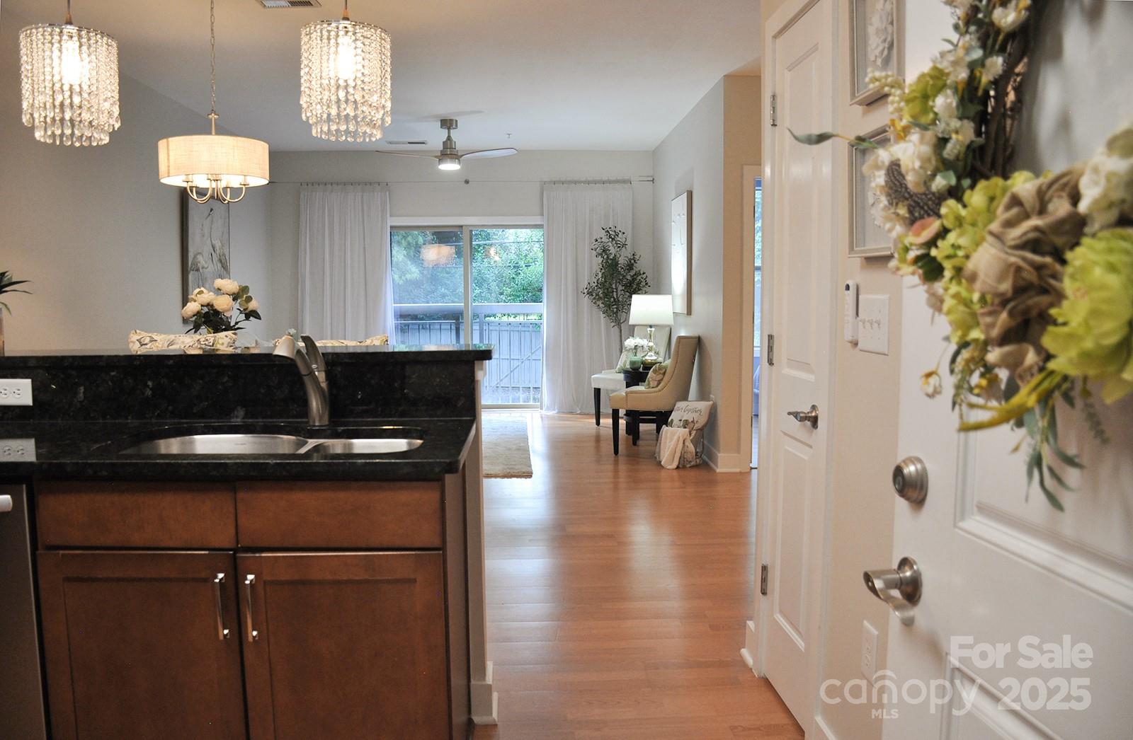 630 Calvert Street, Unit 1110 Charlotte, NC 28208 - Photo 26 of 28 a living room with furniture and a fireplace