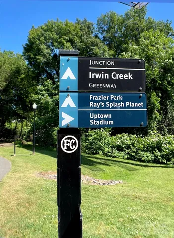 a view of a pathway with a yard