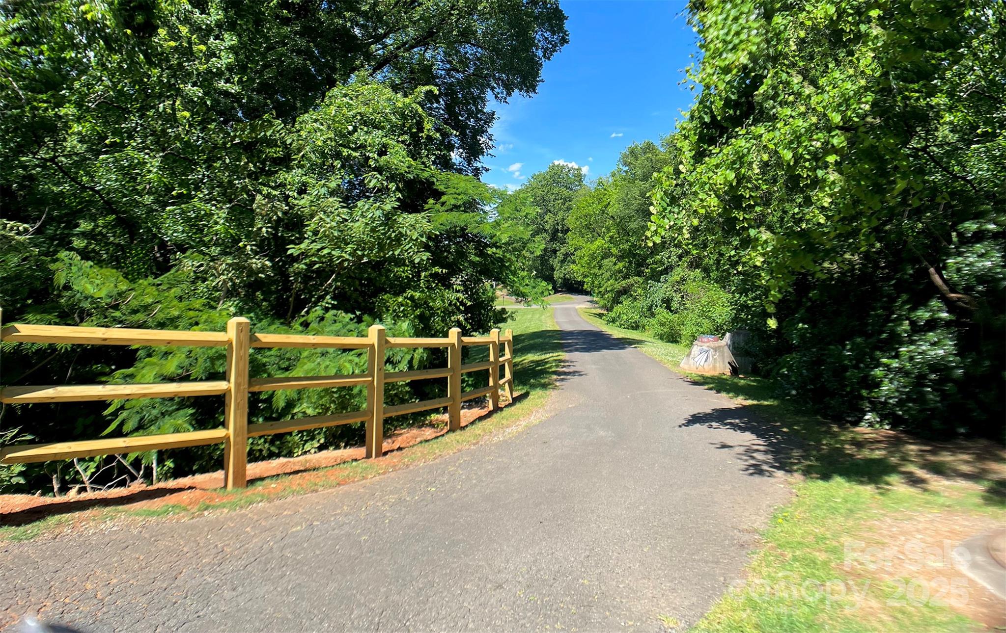 630 Calvert Street, Unit 1110 Charlotte, NC 28208 - Photo 6 of 28 a view of a pathway with a yard