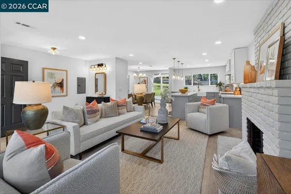 a living room with furniture fireplace and a couch