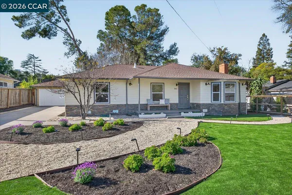 a front view of a house with garden