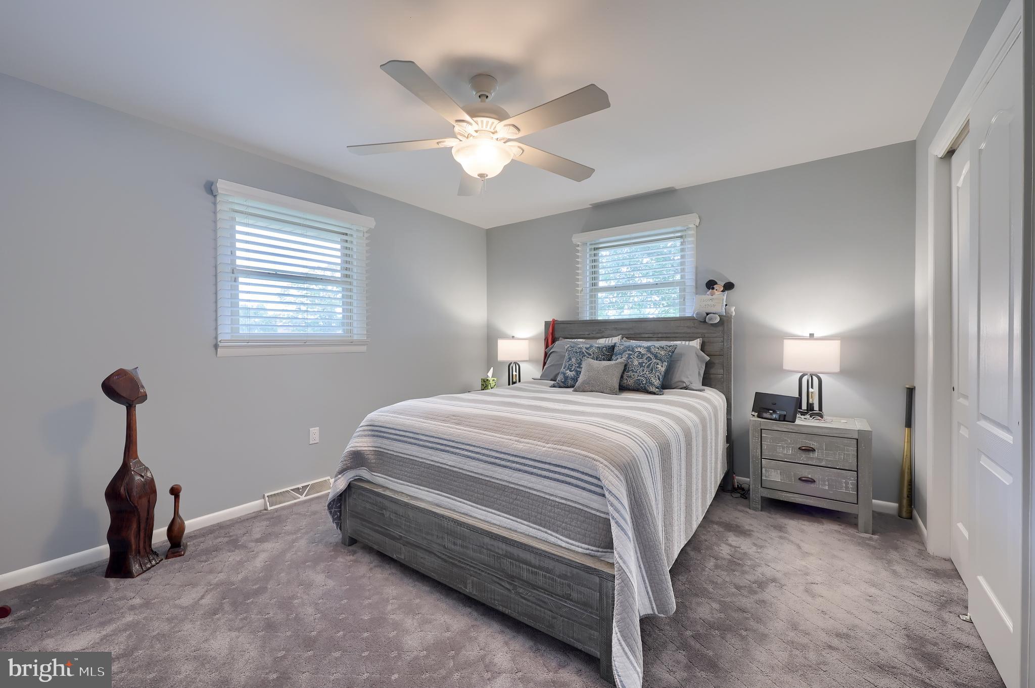310 West Lexington Road Lititz, PA 17543 - Photo 21 of 58 a bedroom with bed and a chandelier
