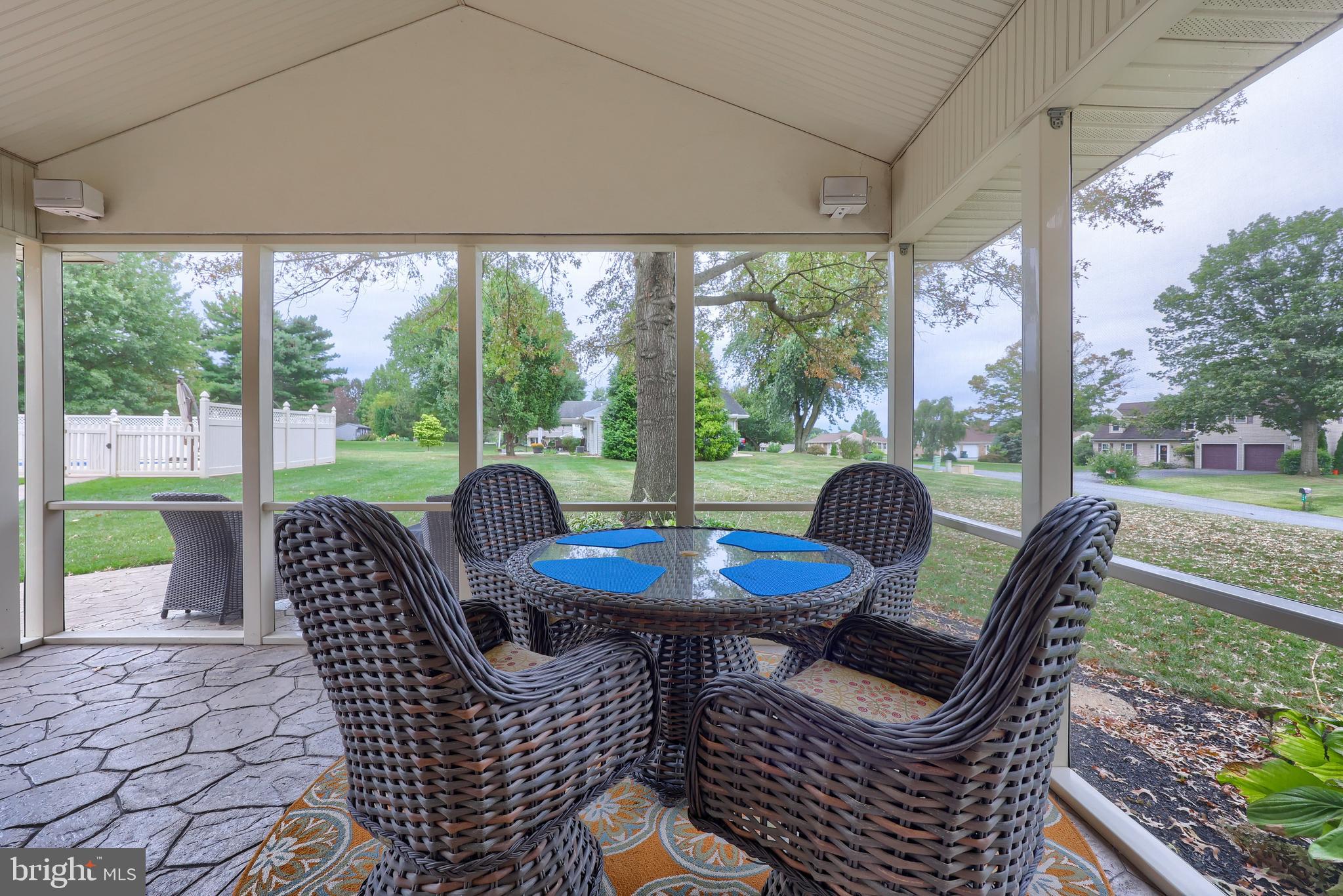 310 West Lexington Road Lititz, PA 17543 - Photo 36 of 58 a view of a patio with a table chairs and a backyard