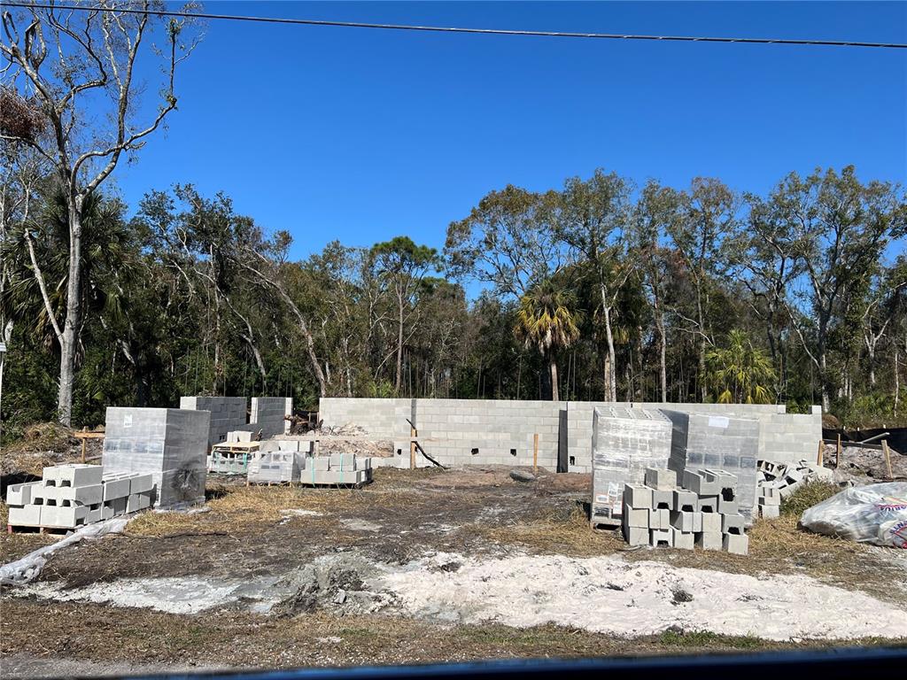 4715 Salvia Street New Port Richey, FL 34652 - Photo 7 of 8 a view of a terrace with a bench